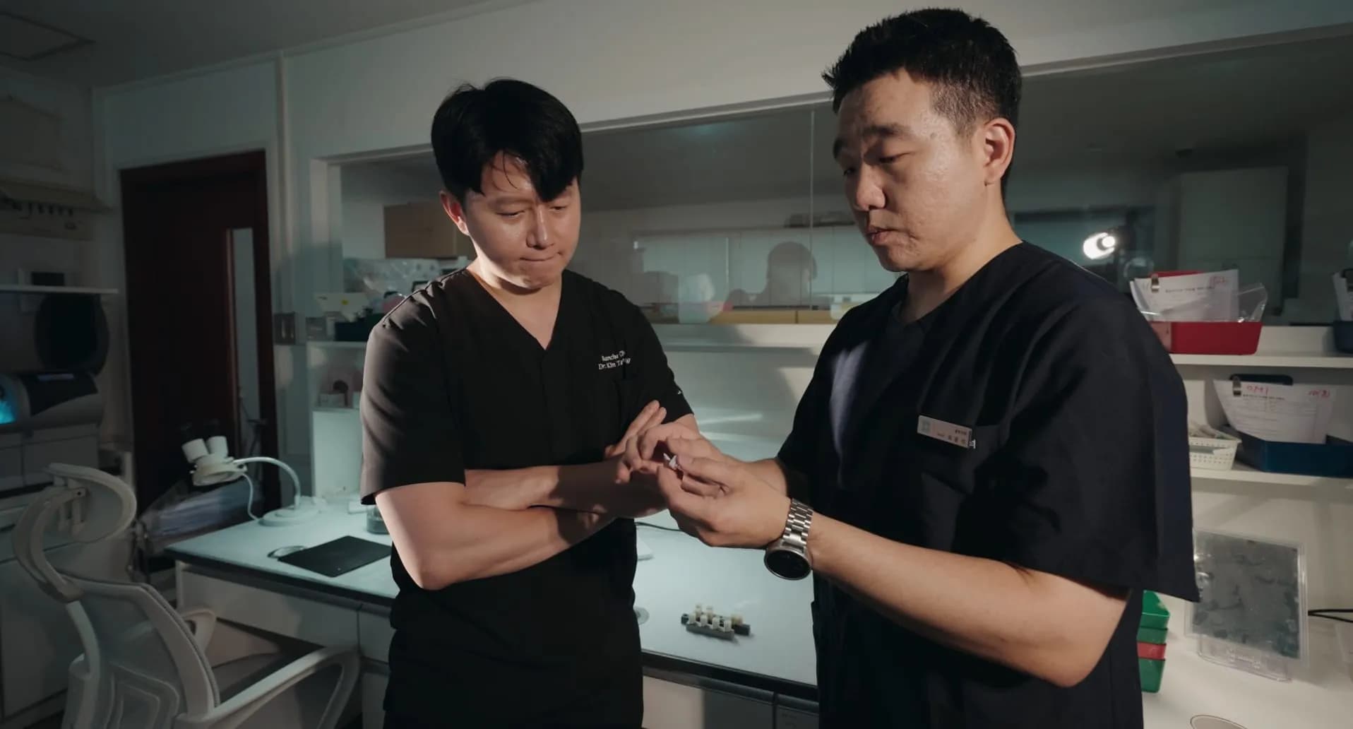 Staff and a lab technician reviewing a prosthesis design together at Blanche Dental's in-house lab